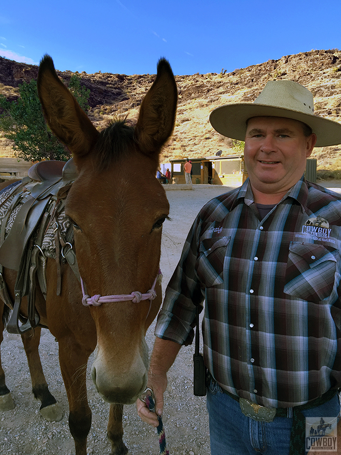 Molly the mule and Craig pose for a picture in front of the bunk house before Horseback Riding in Las Vegas at Cowboy Trail Rides in Red Rock Canyon