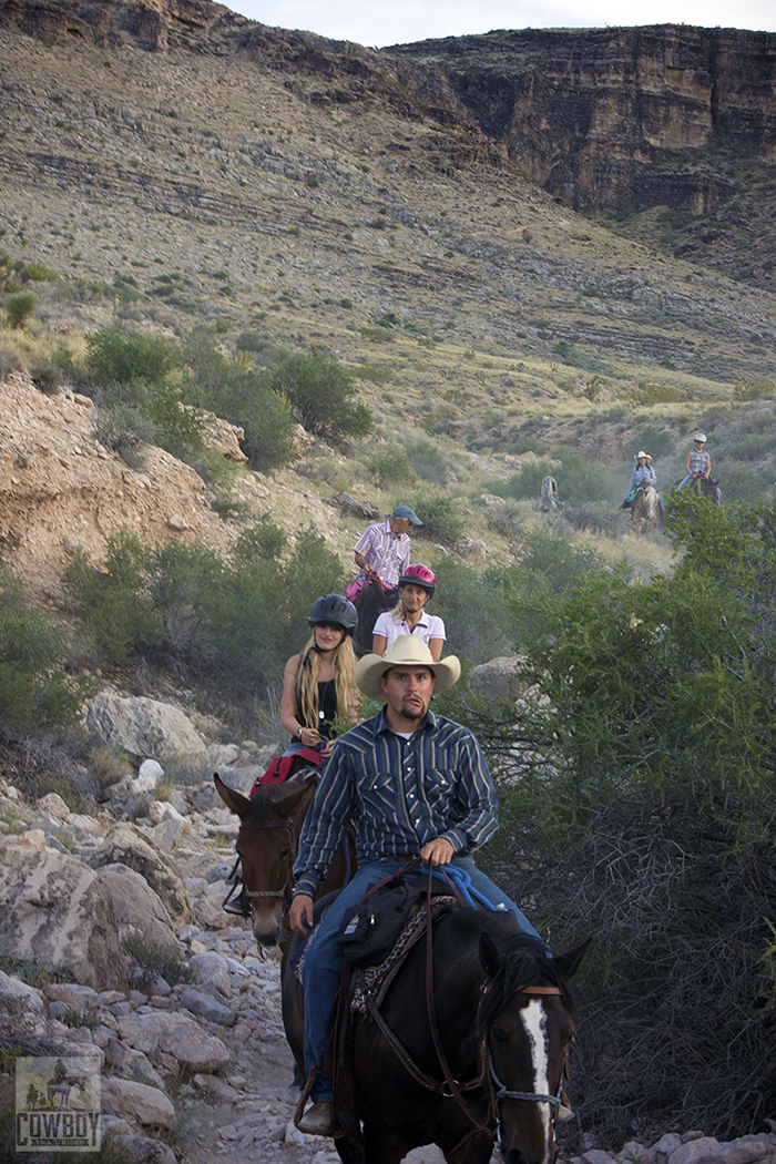 Wrangler Robert mugs for the camera while Horseback Riding in Las Vegas at Cowboy Trail Rides in Red Rock Canyon